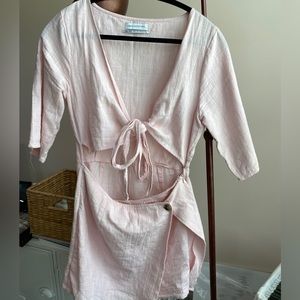 Light pink romper with cut out in mid section and ties. Urban Outfitters size 10